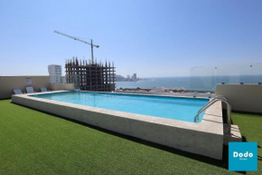 Torre con roof garden y piscina con vista al mar